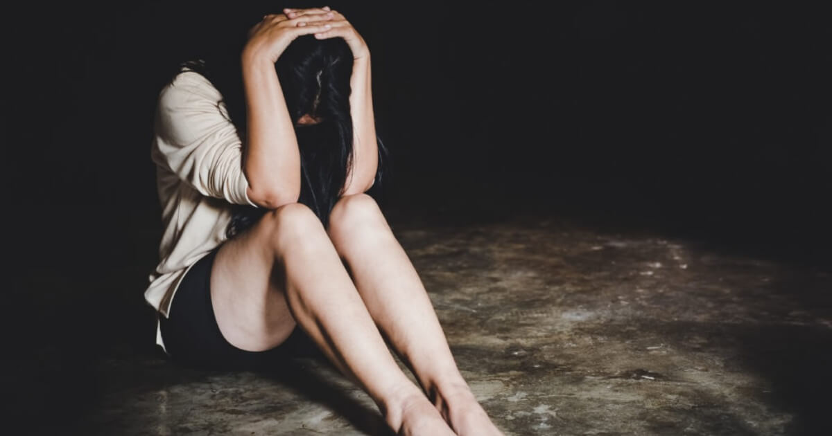 Woman bondage in angle of abandoned building , stop violence aga
