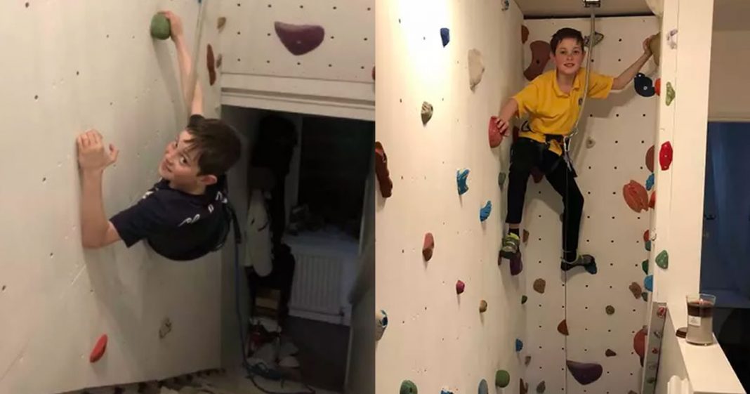 Pai constrói junto com os filhos uma parede de escalada para que se divirtam na quarentena.